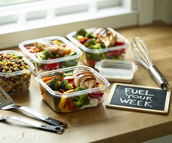 Prepistry Meal Prep System - Complete Kitchen Guide Organized meal prep containers with colorful, healthy meals and cooking tools showcasing complete meal preparation system